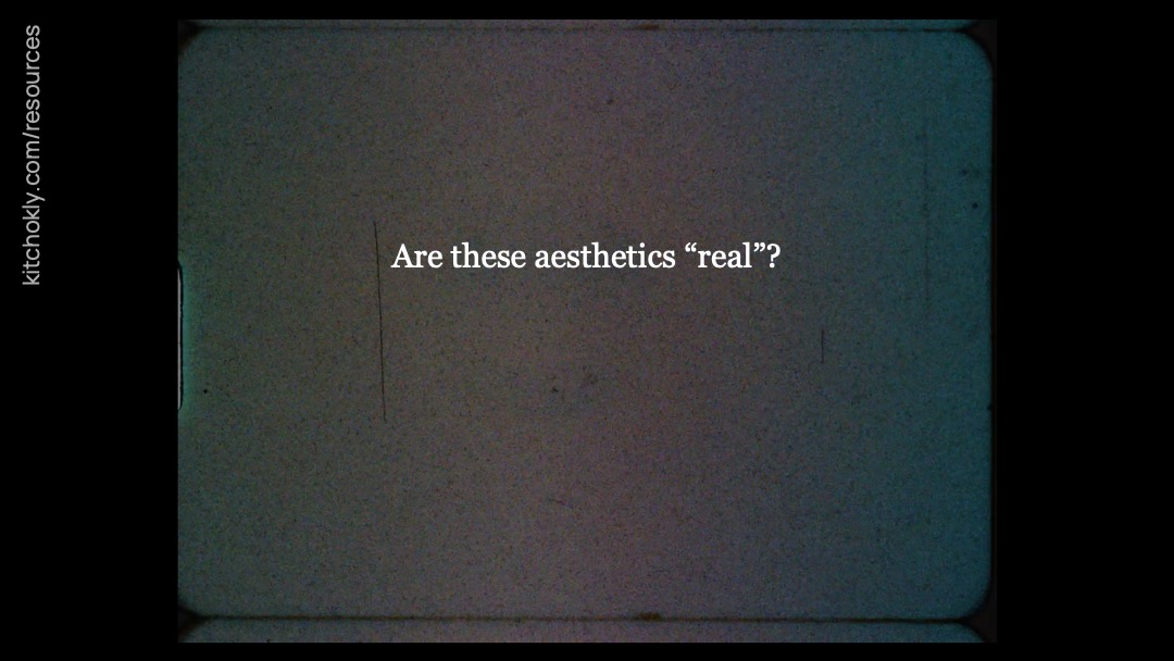 The still, indiscernible frame from the title card returns. Over it reads the text, "Are these aesthetics 'real'?"